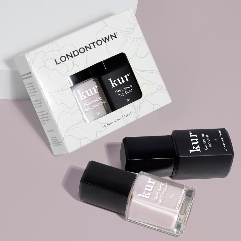 LONDONTOWN's nail care collection is elegantly showcased, featuring two bottles and packaging. One is a white "Conceal + Go Pink," while the other is a black "Gel Genius Top Coat." Achieve natural nails that boast the look of perfection with these essentials.