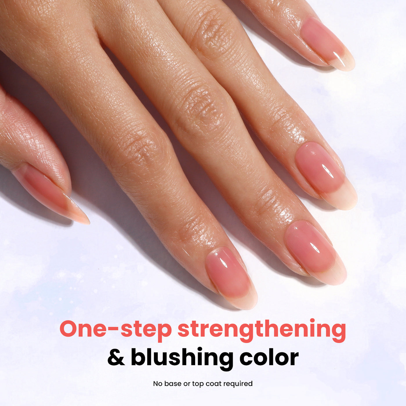 A hand with manicured nails showcasing a natural, pinkish hue is pictured alongside the text "One-step strengthening & blushing color" and "No base or top coat required," featuring LONDONTOWN's Sheer Strength Nail Blush in Poppy for added durability.