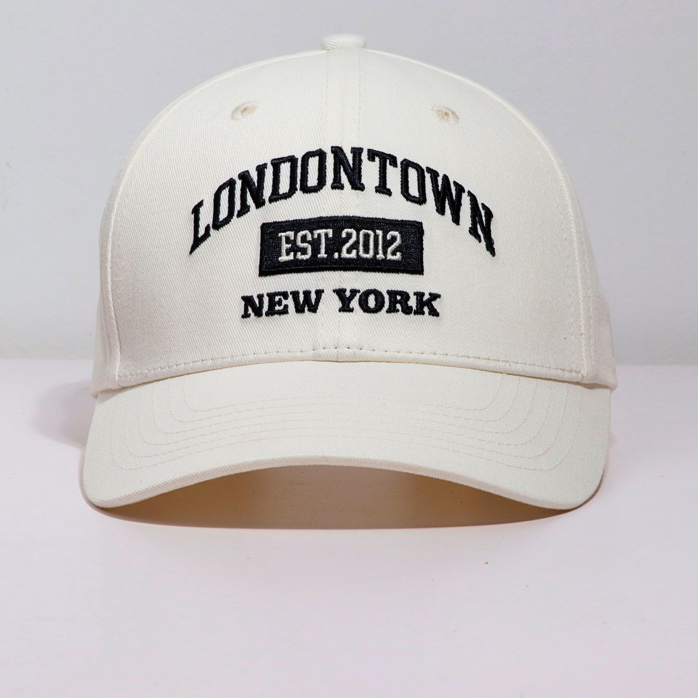 A style-forward accessory, the LONDONTOWN Logo Adjustable Cap features "LONDONTOWN EST. 2012 NEW YORK" embroidered in black on the front, making it perfect for staying sun-smart.