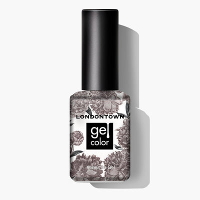 A bottle of Nightcap nail polish by LONDONTOWN, featuring a black and white floral design on the label reminiscent of antique motifs, set against a white background.