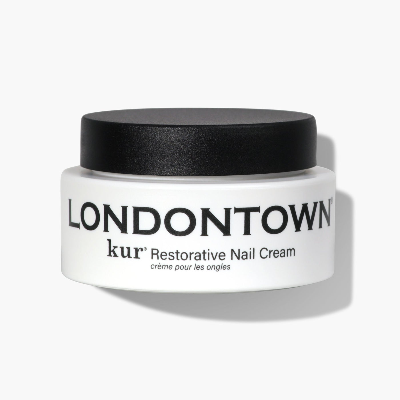 A small white container of LONDONTOWN Restorative Nail Cream (Professional), perfect for dry nails, featuring a black lid on a white background.