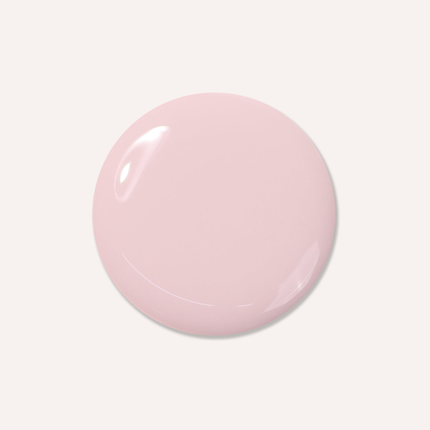 The "Off the Record" by LONDONTOWN, a glossy, light pink circular object, is set against a cool, white background.