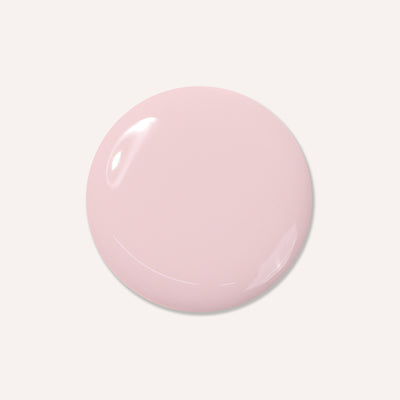 The "Off the Record" by LONDONTOWN, a glossy, light pink circular object, is set against a cool, white background.