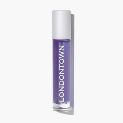 A compact, cylindrical purple bottle with a white cap displays the brand name "LONDONTOWN" vertically along its side, making it ideal for carrying your favorite Roll & Glow Cuticle Oil in Passion Fruit.