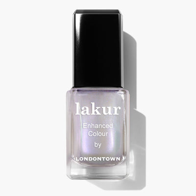 A bottle of Pixi Chrome nail polish by LONDONTOWN with a pearlescent white color and a black cap, featuring a stunning crème-to-chrome finish.