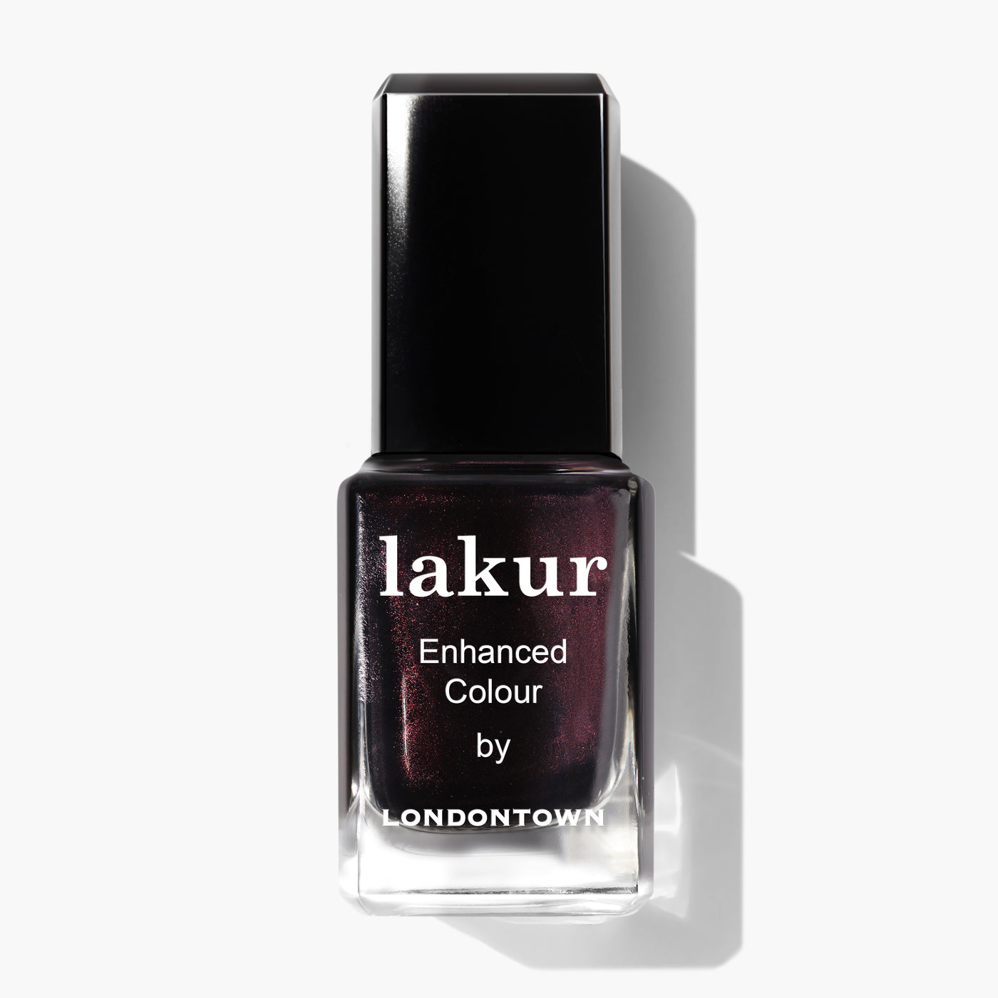 A bottle of Spilled Wine enhanced colour nail polish by LONDONTOWN, featuring a dark, shimmery pinot noir shade and a black cap, shown against a white background.