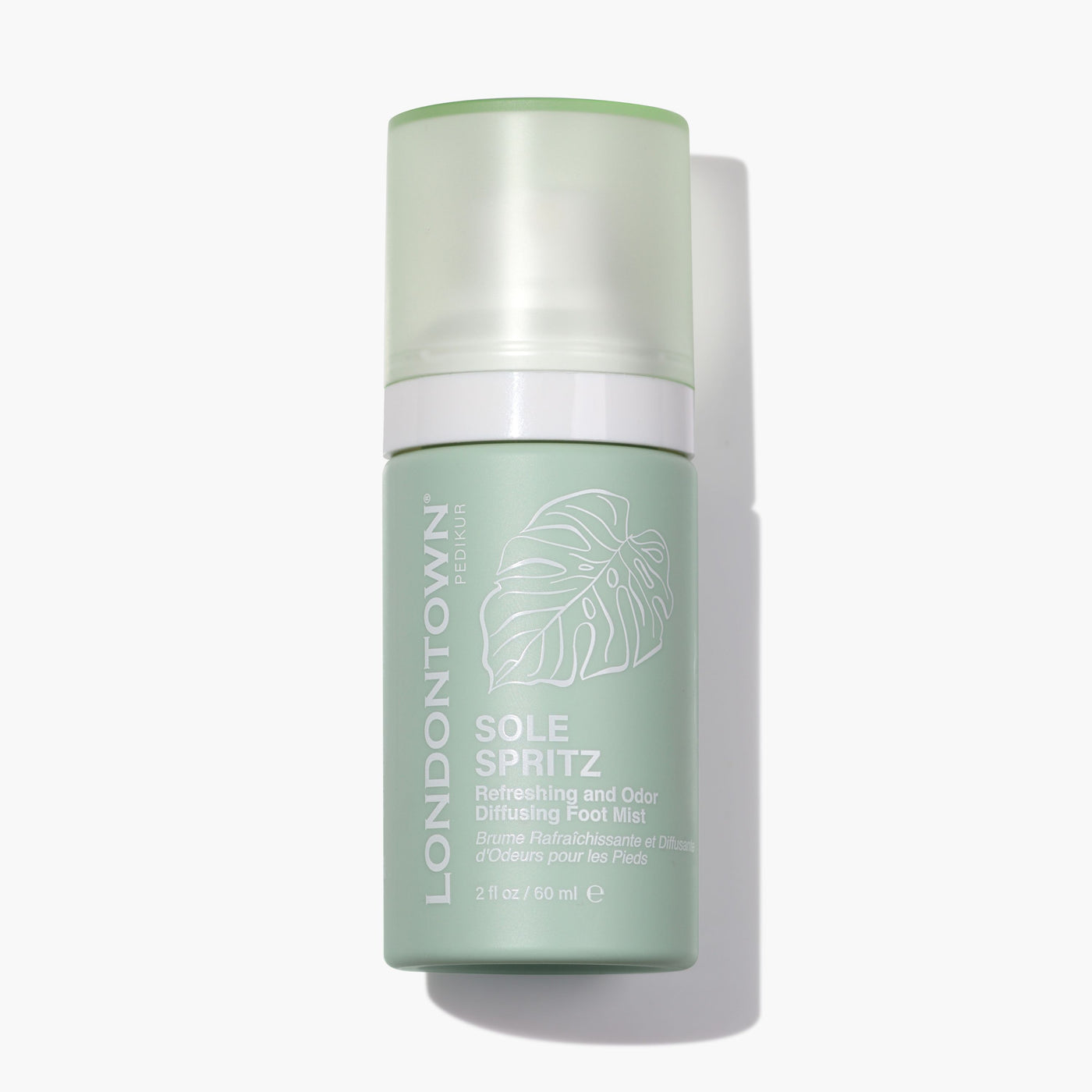 Green bottle of Sole Spritz Foot Mist by LONDONTOWN, 2 fl oz (60 ml), featuring a leaf design on the label, ensures fresh feet with every spritz.