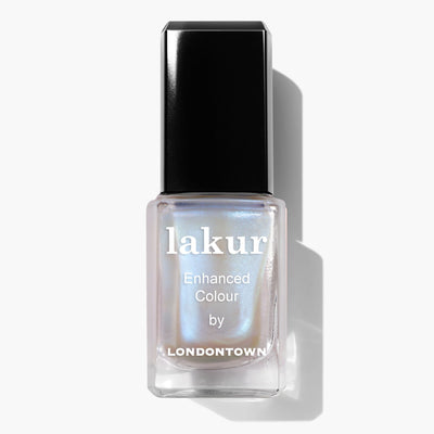 A bottle of Starry Chrome by LONDONTOWN nail polish, featuring an iridescent hue and a black cap, showcases a stunning crème-to-chrome finish.