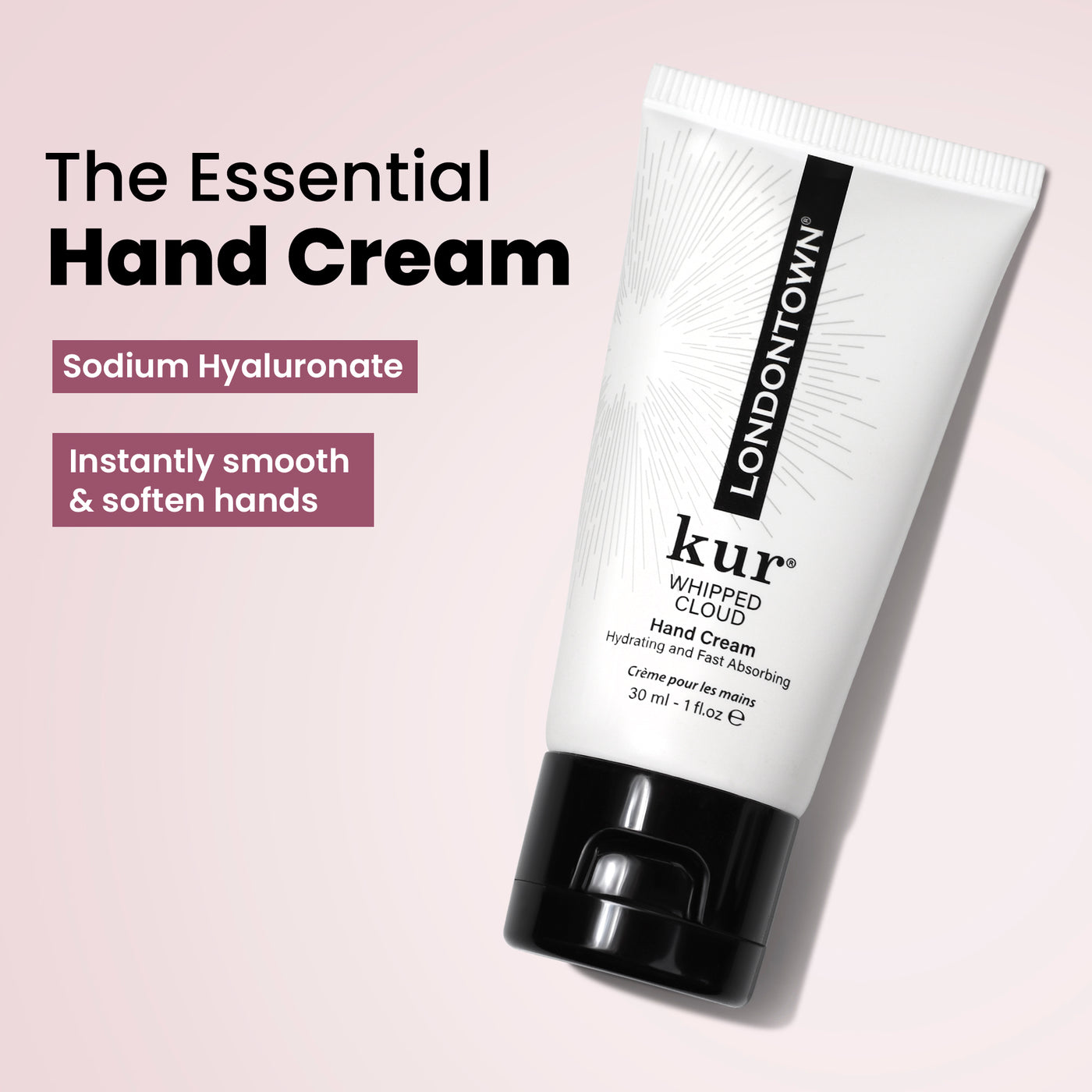 Image of a tube labeled "kur Whipped Cloud Hand Cream" featuring sodium hyaluronate. The white tube, adorned with black text and cap, harmonizes well with the Most-Loved & Must-Haves Set by LONDONTOWN, making it an ideal addition to your holiday wardrobe. Background text emphasizes its smoothing and softening properties, perfect for enhanced nail care and skin pampering.