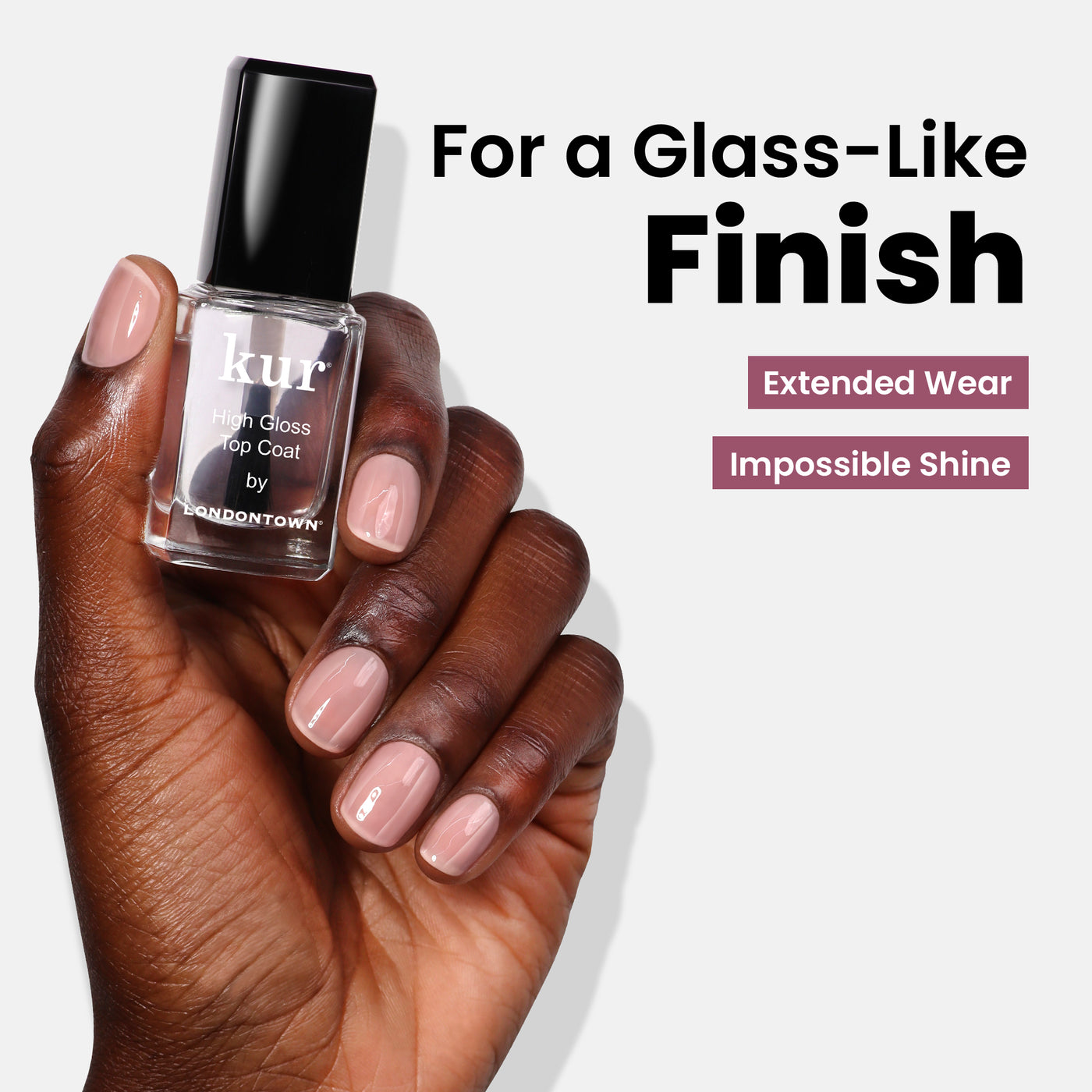 A hand holds the "Most-Loved & Must-Haves Set" by LONDONTOWN, promising "For a Glass-Like Finish" and "Extended Wear, Impossible Shine." It's the ultimate addition to your nail care routine this holiday season, ensuring your nails are as impeccable as your perfect wardrobe.