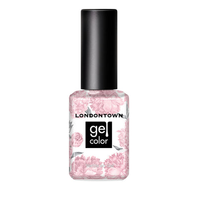 A bottle of LONDONTOWN's Magnolia Haze Gel Color nail polish showcases a versatile petal pink hue with a delicate floral pattern on the label.