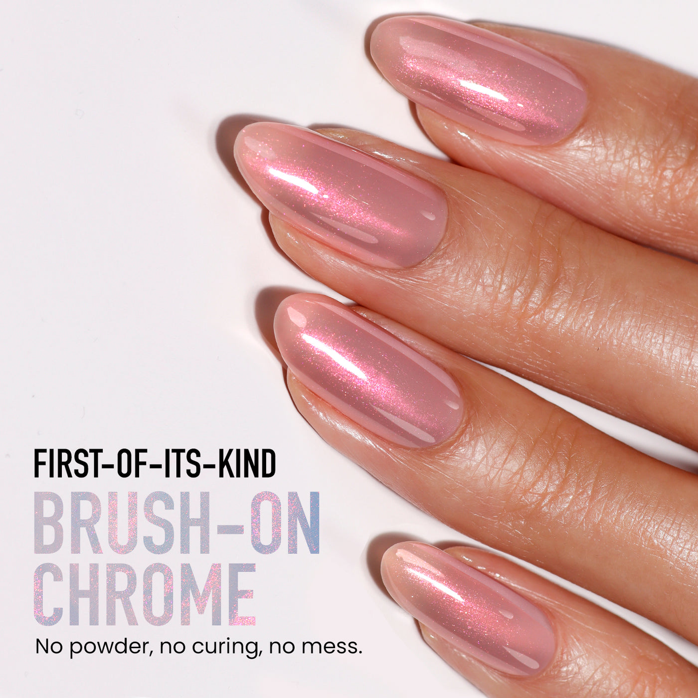 Close-up of a hand with glossy, pink chrome nails. Text reads: "Introducing Aurora Chrome by LONDONTOWN—this first-of-its-kind brush-on chrome with lakur finish requires no powder, curing, or mess.