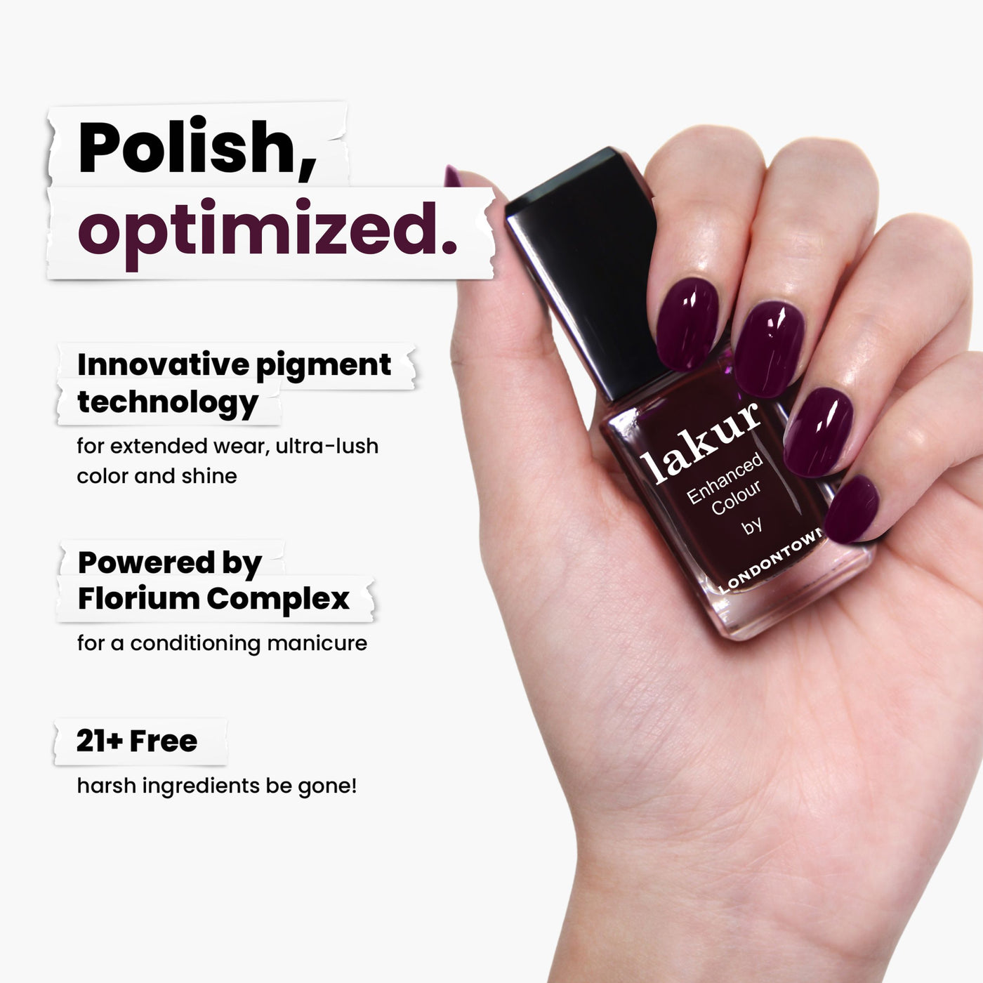 A hand holds a bottle of deep purple Bell in Time nail polish by LONDONTOWN, featuring innovative pigment technology, Florium Complex, and a breathable formula that's 21+ Free. For complete nail wellness, pair with kur® care.