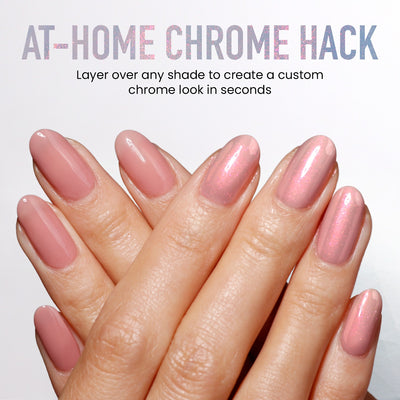 Close-up of hands with pink, glossy, chrome-finish nails; text above reads: "AT-HOME CHROME HACK. Use Aurora Chrome by LONDONTOWN to layer over any shade and create a custom crème-to-chrome look in seconds.