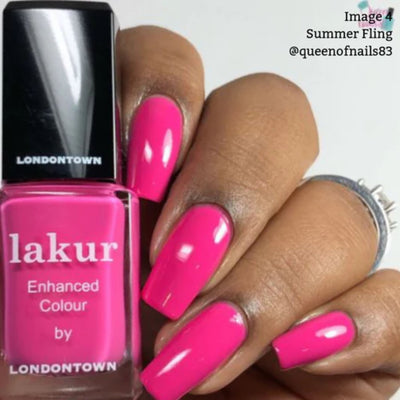 A hand with shocking pink nail polish holds a bottle labeled "lakur Summer Fling by LONDONTOWN," highlighting its vibrant, vegan, and cruelty-free formula.