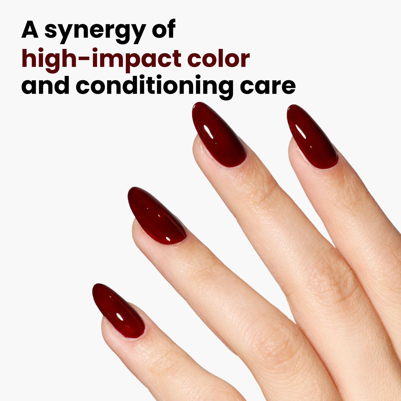 Close-up of a hand with long, glossy, dark burgundy crème nails against a white background. Text reads: "Lady Luck by LONDONTOWN - A synergy of sultry, high-impact color and conditioning care.