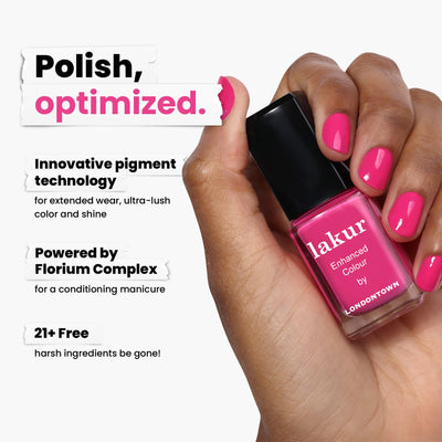 A hand holds a bottle of shocking pink "Summer Fling" nail polish by LONDONTOWN, showcasing its innovative, vegan pigment technology, Florium Complex. It's cruelty-free and free from 21+ harsh ingredients.