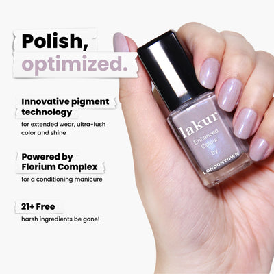 A hand holds LONDONTOWN’s Opal lakur nail polish in shimmering lilac, boasting pigment technology and the Florium Complex. Part of the Londontown collection, it's 21+ free from harsh ingredients, completely vegan, and cruelty-free.