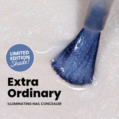 Close-up of a brush applying shimmery blue nail concealer on a light surface. Text reads: "Limited Edition Exclusive Shade!" and "LONDONTOWN: Illuminating Nail Concealer." Discover our Illuminating Essentials Mini Concealer Set for more vibrant possibilities.