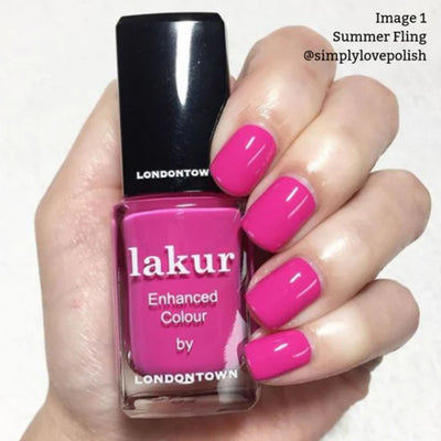 A hand holds a bottle of shocking pink nail polish labeled "Summer Fling" by LONDONTOWN. The vegan, cruelty-free formula enhances nails with a vibrant shade matching the bright pink bottle.