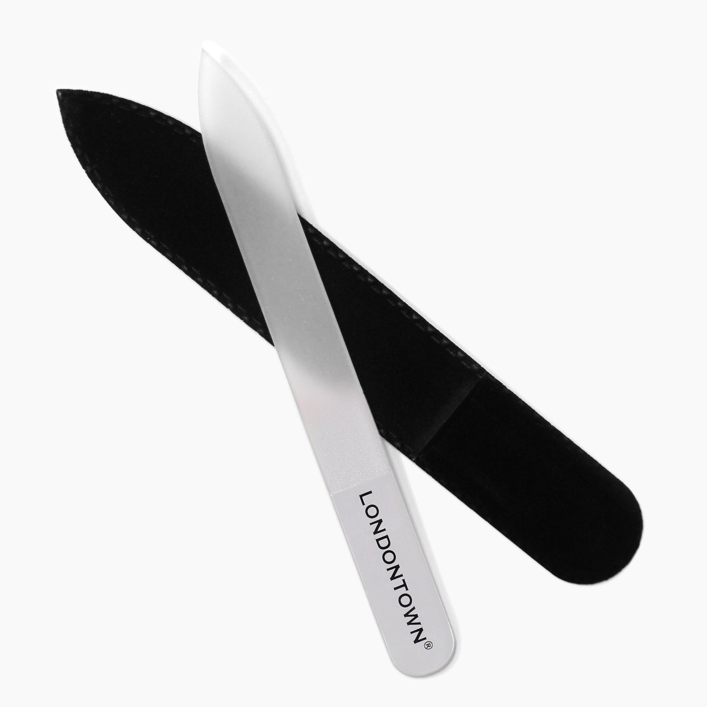 A clear glass nail file by LONDONTOWN, partially snug inside a black velvet sleeve, set against a plain white backdrop for seamless and damage-free nail filing.