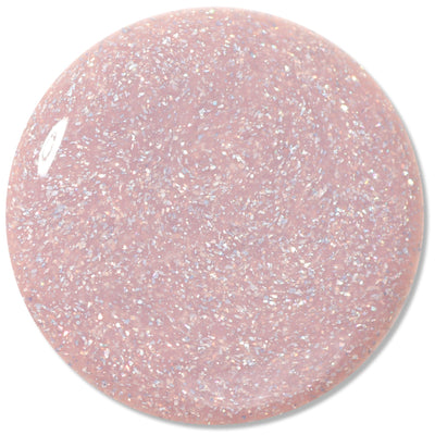 The LONDONTOWN "Champagne in Bed" nail polish is a holographic pink shade infused with fine silver glitter.