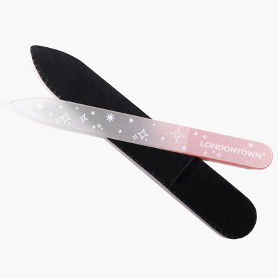 The LONDONTOWN Glass Nail File - Pink Sparkle, adorned with the "LONDONTOWN" logo and partially inserted in a black case, provides effortless, damage-free nail filing.