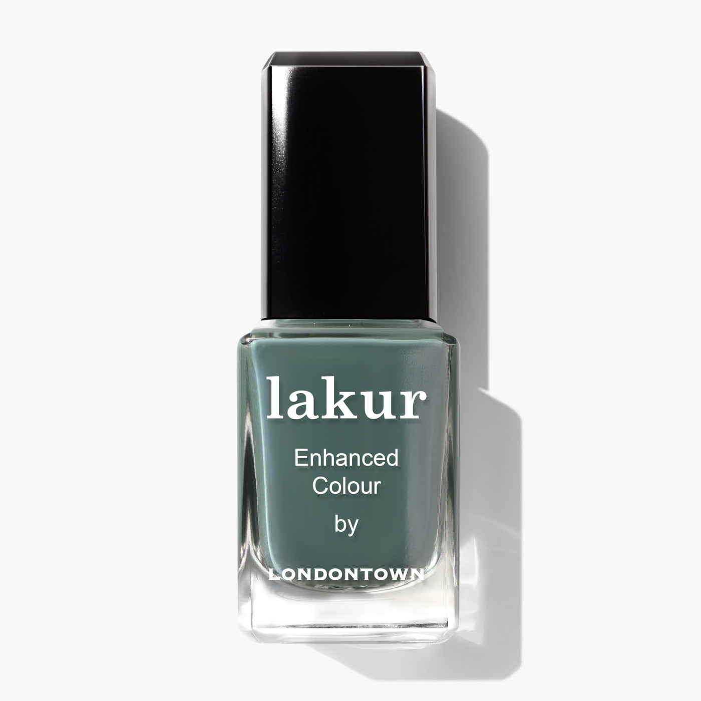 A bottle of Velvet Drapes nail polish by LONDONTOWN, showcasing a sumptuous teal shade with hints of olive green, featuring a black cap and white text on the label.