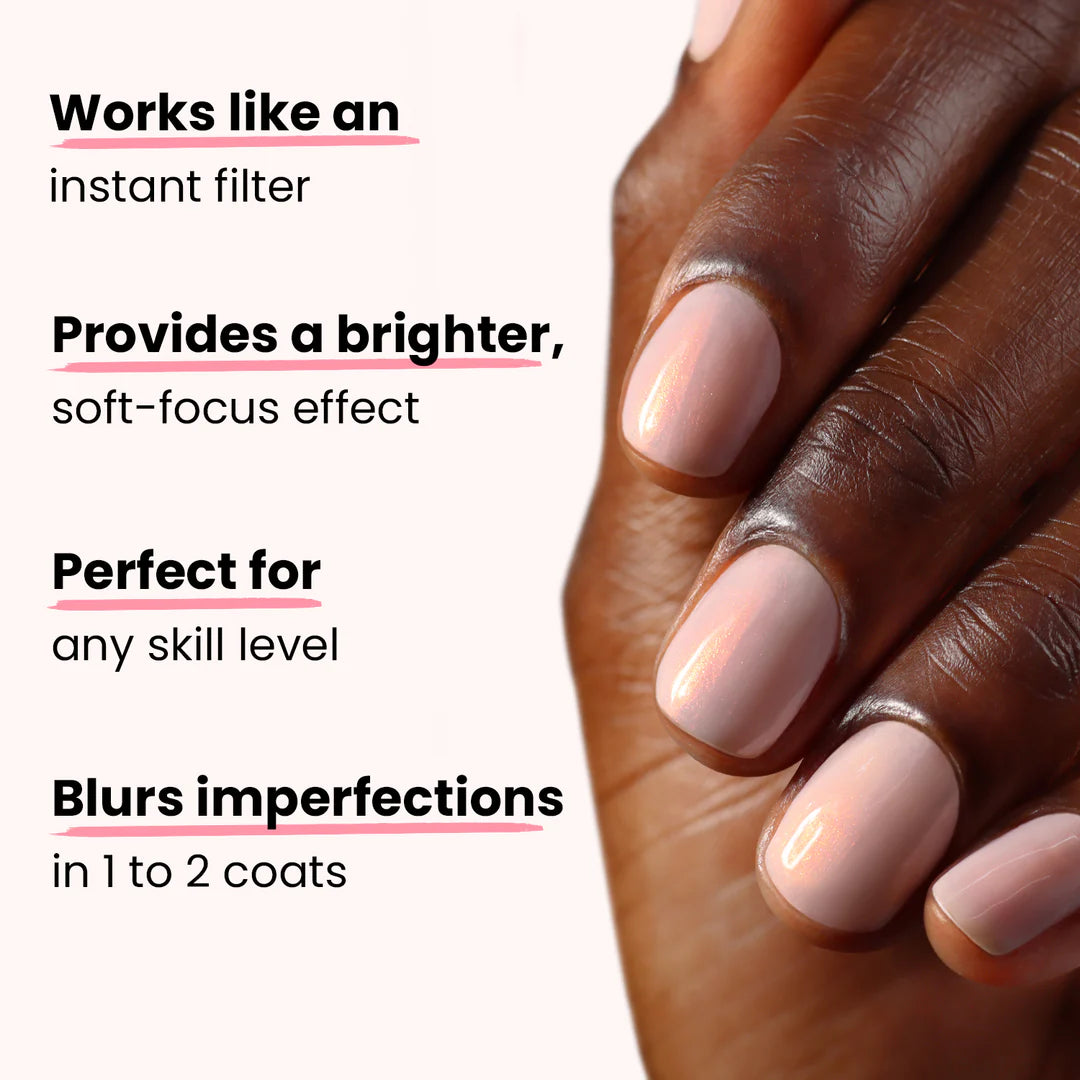 A hand with light pink Conceal + Go Bubble nail polish by LONDONTOWN, showcasing naturally perfect nails, is displayed over text highlighting the polish's features: instant filter effect, brighter soft-focus, suitable for all skill levels, and blurring imperfections.