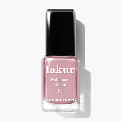 A bottle of Berry Nude (Professional) nail polish by LONDONTOWN, in a light pink shade reminiscent of whipped cream, with a black cap and white text reading "lakur Enhanced Colour by LONDONTOWN".