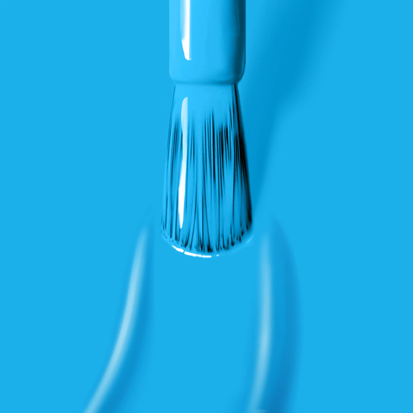 A close-up of a LONDONTOWN Cabana Boy (Professional) paintbrush applying neon blue paint with visible brush strokes on a matching blue background.