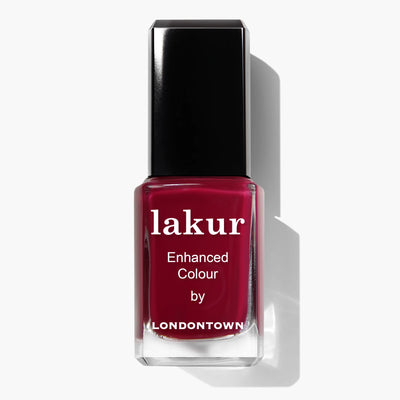 A bottle of LONDONTOWN's Dragon Fruit (Professional) nail polish in dark red with a black cap, boasting a vegan and cruelty-free formula.