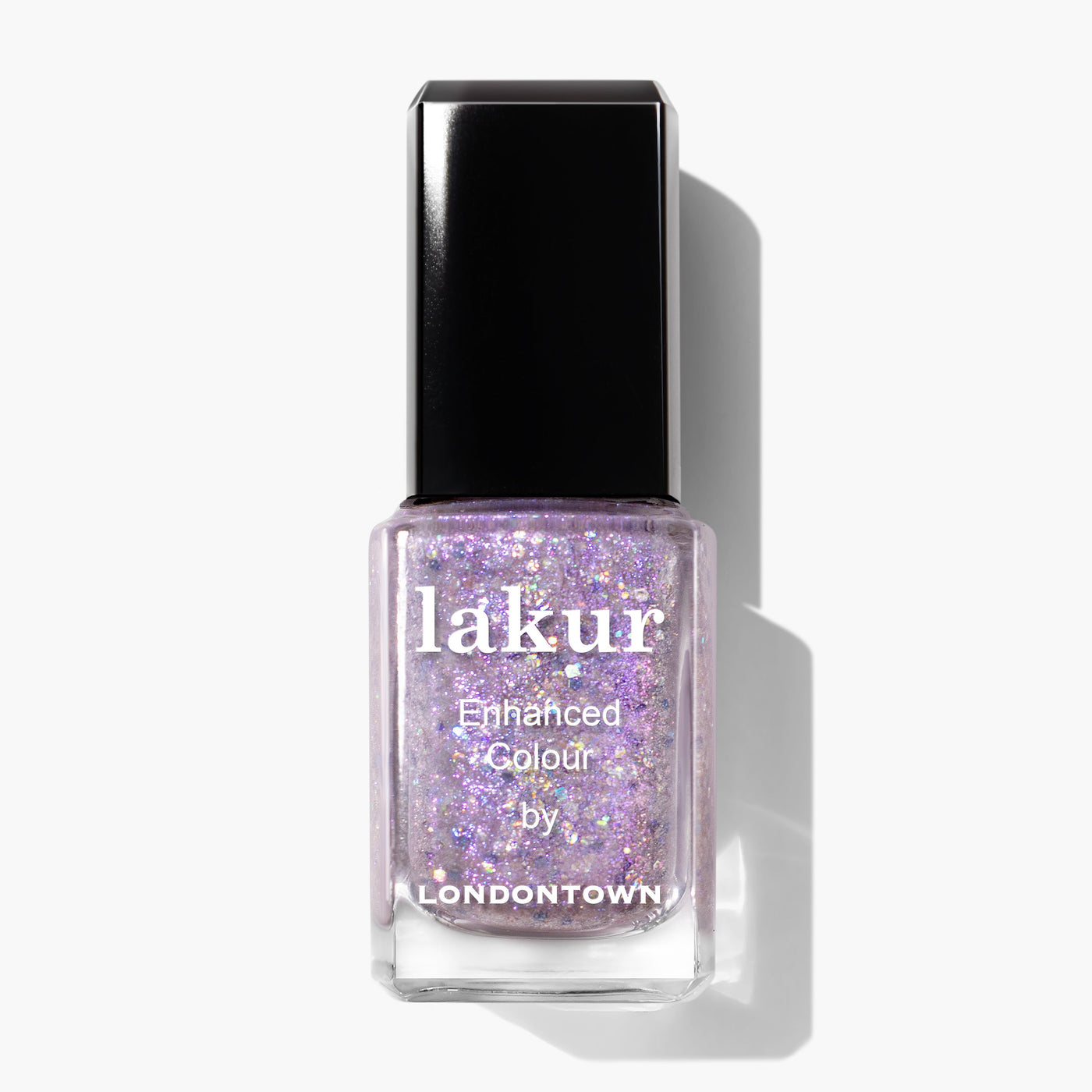 A square bottle of LONDONTOWN's professional nail polish, "Grape Fizz," featuring a black cap and filled with glittery, lavender nail polish accented by hints of holographic purple glitter.