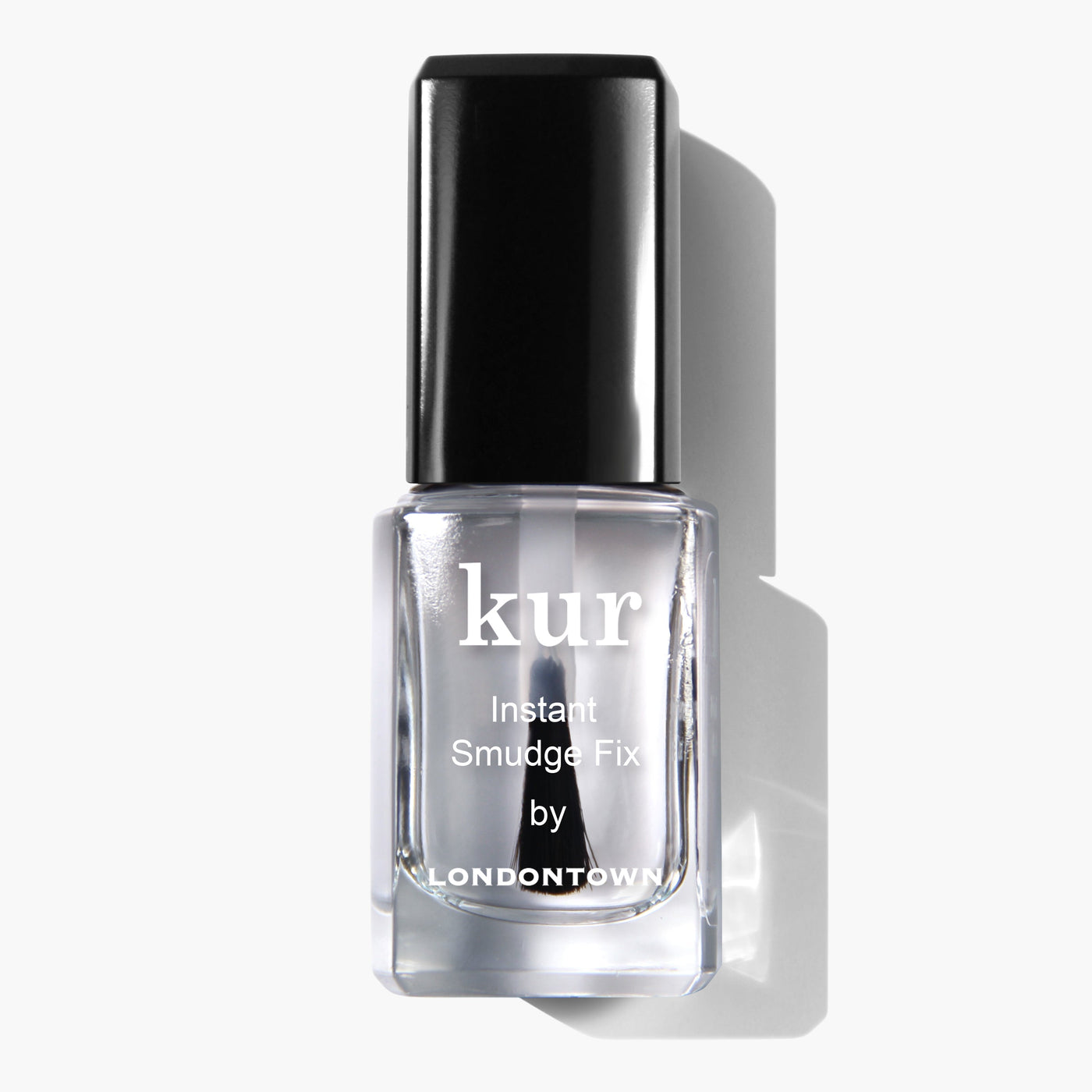 A clear nail polish bottle labeled "Instant Smudge Fix (Professional) by LONDONTOWN" with a black cap, placed against a white background. This vegan, cruelty-free solution promises impeccable nail polish repair in an instant.